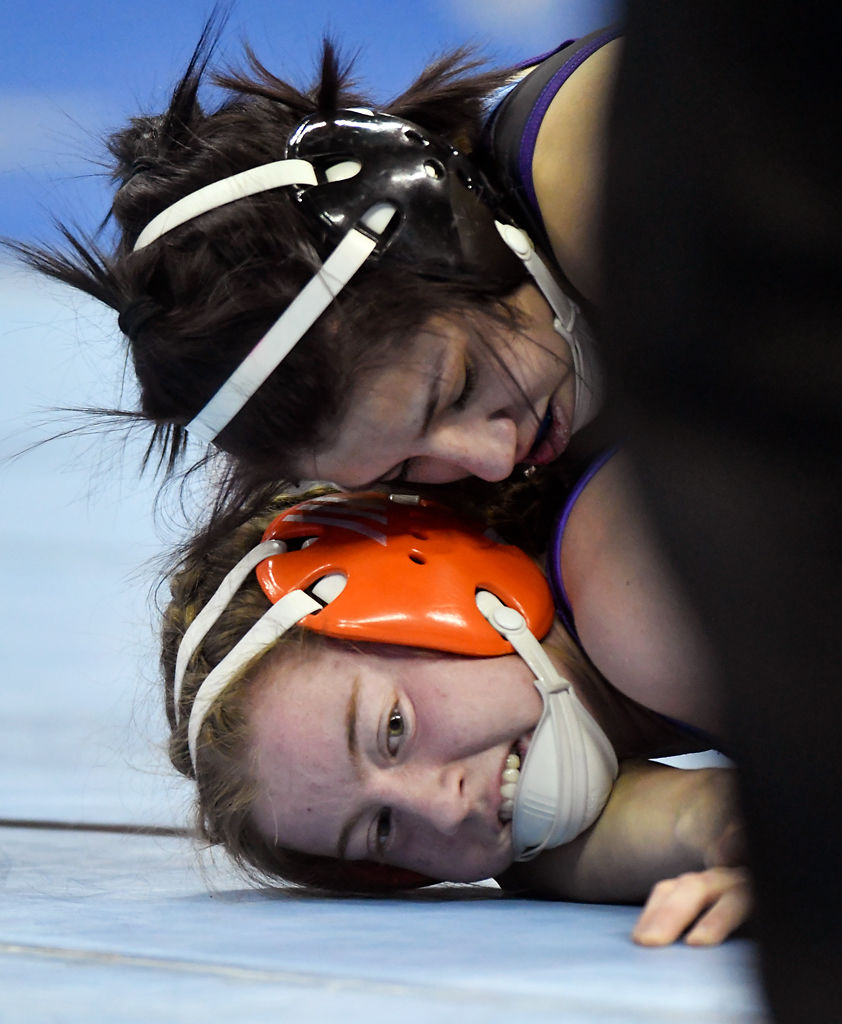 Hickman High School's Mary Belle Harrell is pinned to the ground by Troy Buchanan's Autumn Flanigan